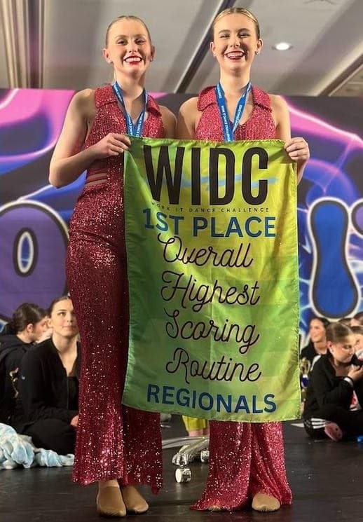 Duet holding the WIDC 1st Place Overall Highest Scoring Routine banner